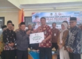 BAZNAS, OJK, dan Kesbangpol Banyumas Sinergi Salurkan Bantuan Produktif dan Edukasi Keuangan